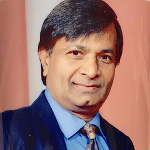 Portrait photograph of Dr O P Garg